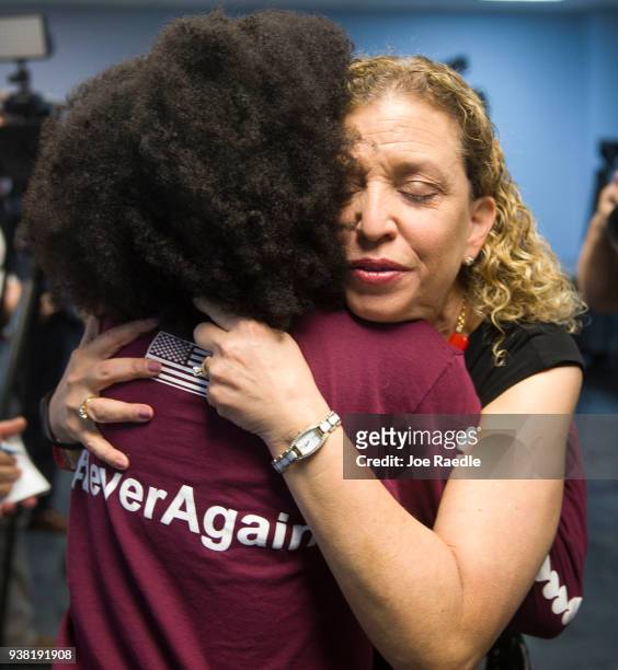 Rep. Debbie Wasserman Schultz hugs Tyah-Amoy Roberts a junior at Marjory Stoneman Douglas High School who survived the shooting on Valentine's Day...