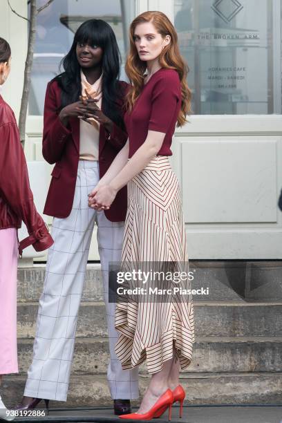 Models Duckie Thot and Alexina Graham are seen on the set of new 'L'Oreal' shooting at 'Broken Arm Cafe' on March 26, 2018 in Paris, France.