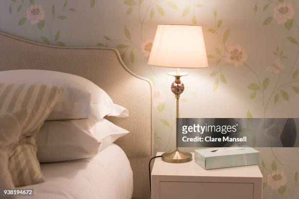 bedside table with light - lamp shade stock pictures, royalty-free photos & images