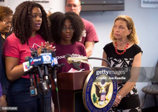 Rep. Debbie Wasserman Schultz listens as Mei-Ling Ho-Shing and Tyah-Amoy Roberts, both students at Marjory Stoneman Douglas High School who survived...