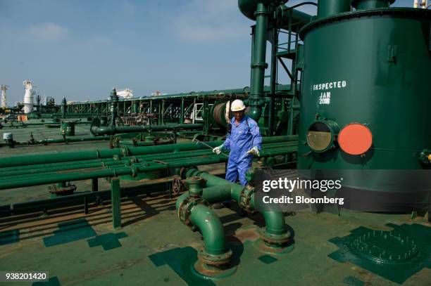 Crew man works on the deck of oil tanker 'Devon' as it prepares to transport crude oil from Kharq Island to India in Bandar Abbas, Iran, on Friday,...