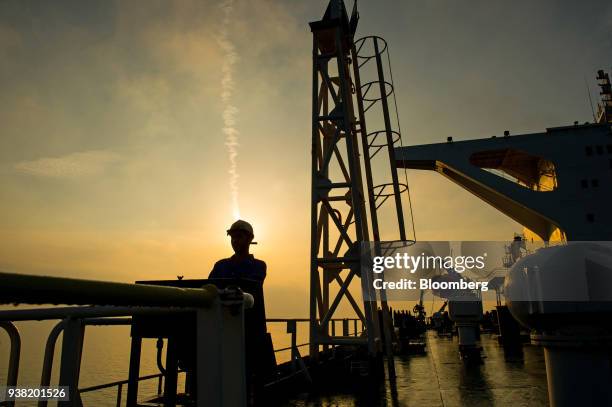 Crew man stands on the deck of the crude oil tanker 'Devon' as it sails through the Persian Gulf towards Kharq Island oil terminal to transport crude...