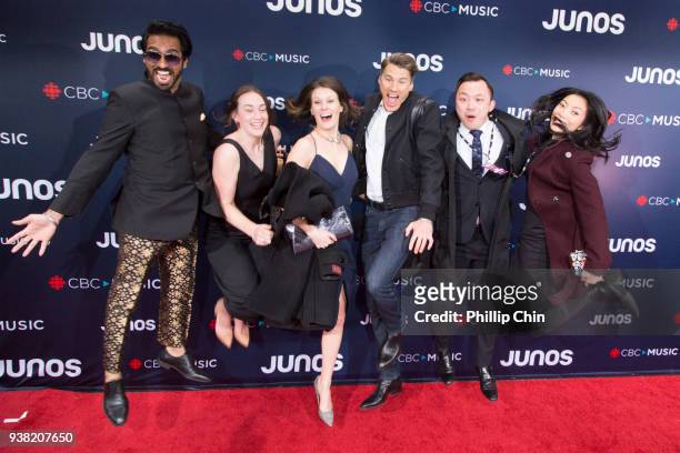 Mayor Gregor Robertson and his staff jump for joy at the red carpet arrivals at the 2018 Juno Awards at Rogers Arena on March 25, 2018 in Vancouver,...
