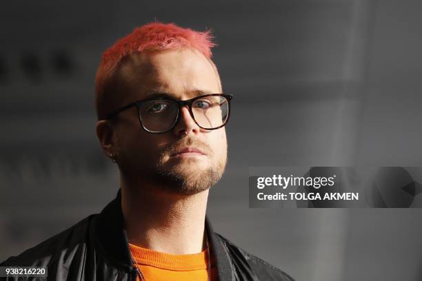 Canadian data analytics expert and whistle-blower, Christopher Wylie poses for photographs outside a press conference in London on March 26, 2018....