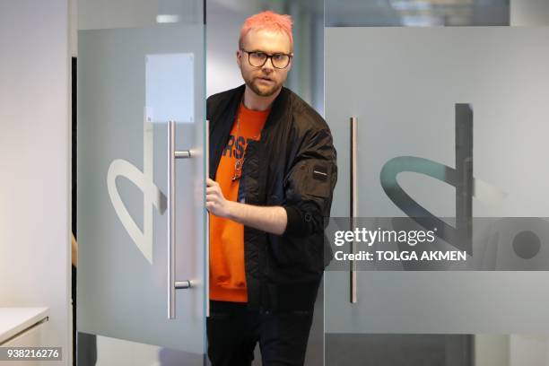Canadian data analytics expert and whistle-blower, Christopher Wylie poses for photographs outside a press conference in London on March 26, 2018. -...