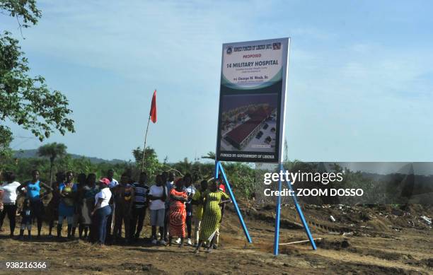 People attend a groundbreaking ceremony of the first military hospital, the "14 Military hospital", on March 26, 2018 at Edward Binyah Kesselly...