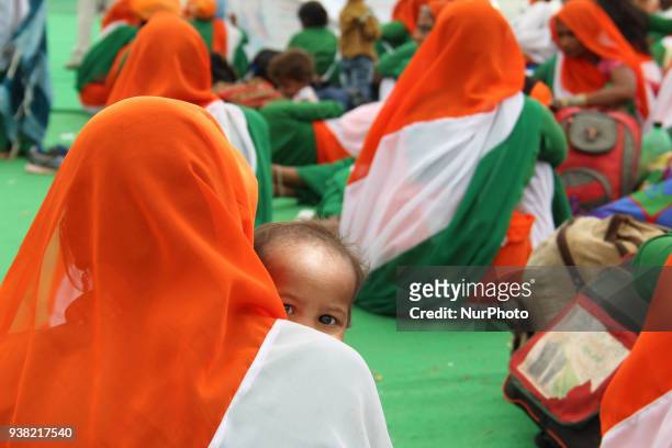 Mother hold her child at Ramleela Ground as the Strike enters in day 4 during a fasting protest against the central government at Ramlila Maidan in...
