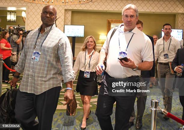 New York Jets head coach Todd Bowles and Philadelphia Eagles head coach Doug Pederson head to meeting during the 2018 NFL Annual Meetings at the Ritz...