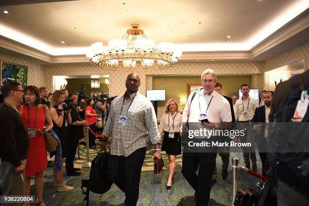 New York Jets head coach Todd Bowles and Philadelphia Eagles head coach Doug Pederson head to meeting during the 2018 NFL Annual Meetings at the Ritz...