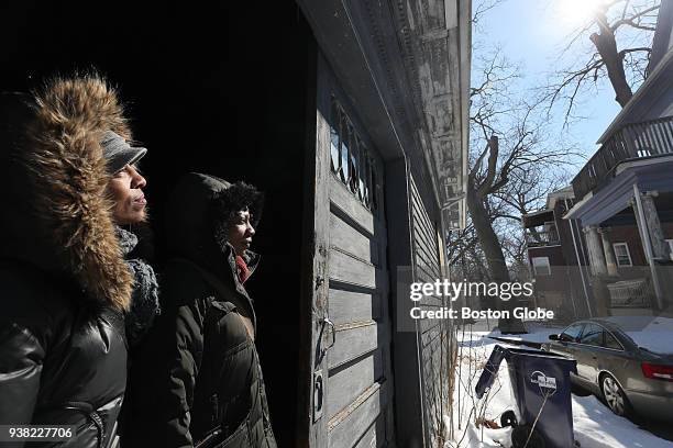 Carolle Nau, left, and Bridgette Wallace stand in the carriage house of the Hutchings Street Victorian they bought in the Roxbury neighborhood of...