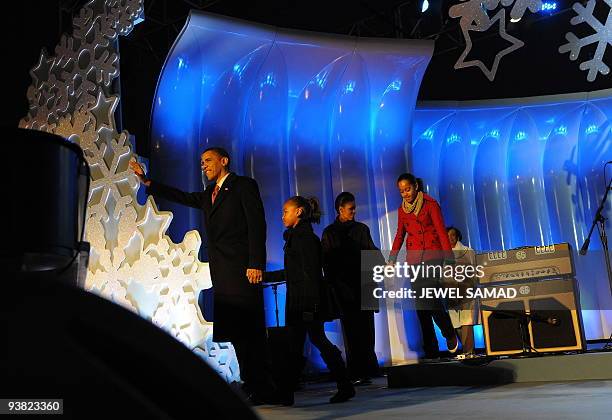 President Barack Obama, accompanied by First Lady Michelle Obama and their dauthers Malia and Sasha, attend the National Christmas Tree Lighting...