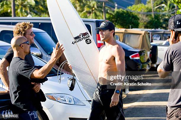 Rainos Heyes, Luke Egan of Australia and Joel Parkinson of Australia chat after Parkinson advanced through his round of 64 heat at the O'Neill World...