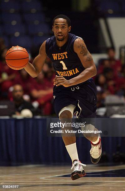 Da'Sean Butler of West Virginia dribbles the ball on the fast break against Portland during the 76 Classic at Anaheim Convention Center on November...