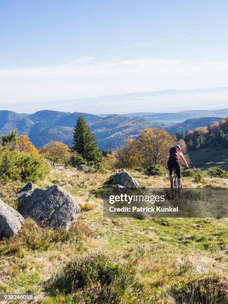 man riding electric mountain bike on cycling tour in the vosges, france - ausdauer stock pictures, royalty-free photos & images