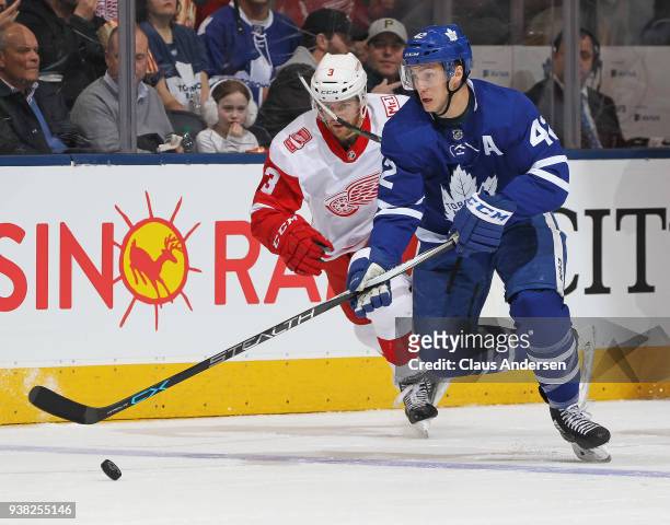 Tyler Bozak of the Toronto Maple Leafs skates with the puck against the Detroit Red Wings during an NHL game at the Air Canada Centre on March 24,...