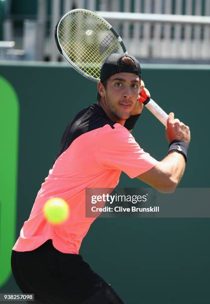 Thanasi Kokkinakis of Australia plays a backhand against Fernando Verdasco of Spain in their third round match during the Miami Open Presented by...