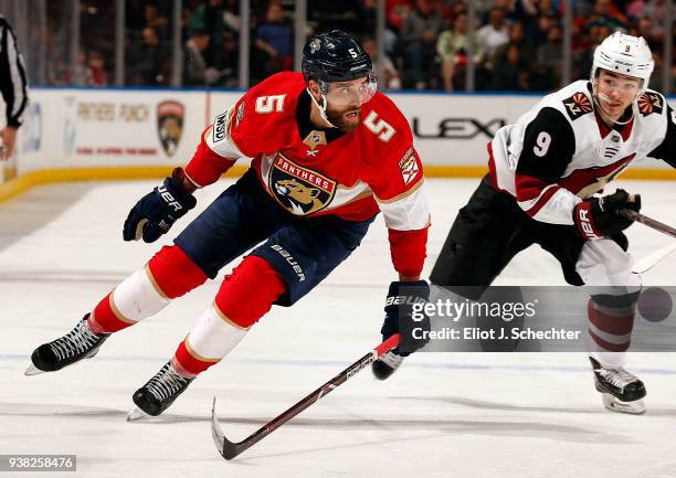 Aaron Ekblad of the Florida Panthers skates for position against Clayton Keller of the Arizona Coyotes at the BB&T Center on March 24, 2018 in...