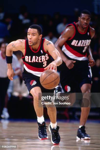 Damon Stoudamire of the Portland Trail Blazers moves up the court during the game against the LA Clippers circa 1997 at the LA Sports Arena in Los...