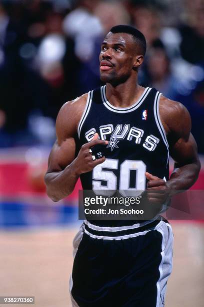 David Robinson of the San Antonio Spurs looks on during a game against the Los Angeles Lakers circa 1996 at the LA Sports Arena in Los Angeles,...
