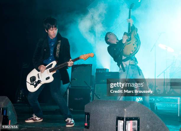 Johnny Marr and Ryan Jarman of The Cribs perform on stage at Brixton Academy on December 3, 2009 in London, England.