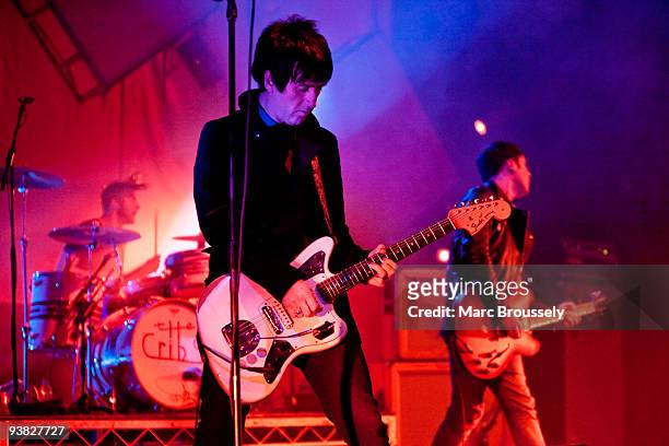 Ross Jarman, Johnny Marr and Ryan Jarman of The Cribs perform on stage at Brixton Academy on December 3, 2009 in London, England.