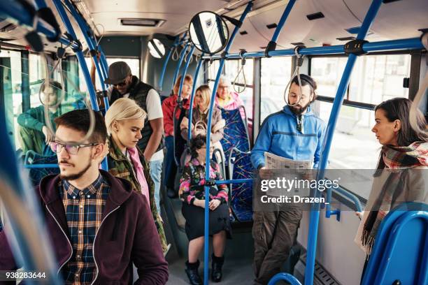 morning bus is crowded with multi ethnic people - bus advertisement stock pictures, royalty-free photos & images