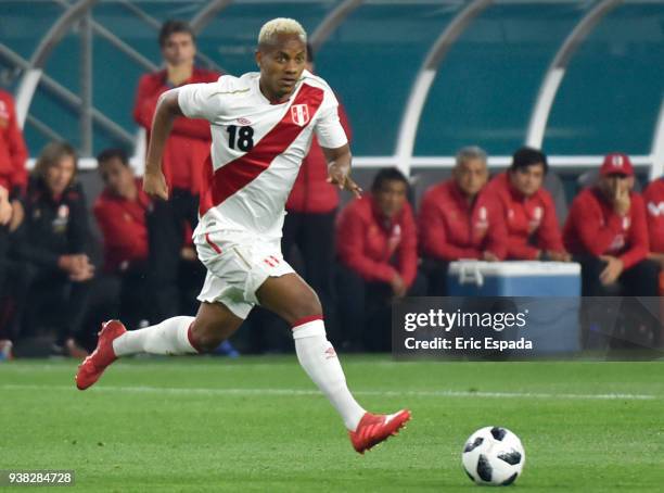 Andre Carrillo of Peru drives the ball during the international friendly match between Peru and Croatia at Hard Rock Stadium on March 23, 2018 in...