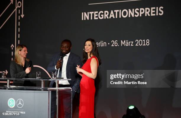 Nia Kuenzer and Gerald Asamoah speak to the audience during Integration Prize Awarding Ceremony at Axica Kongress- und Tagungszentrum on March 26,...