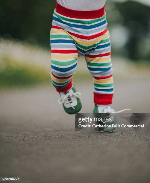 baby running - little feet stock pictures, royalty-free photos & images