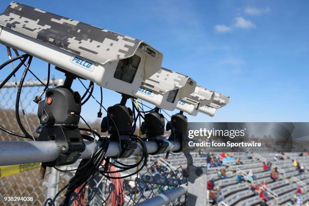 Pit road cameras high above the track during the weather delayed running of the NASCAR Camping World Truck Series Alpha Energy Solutions 250 on March...