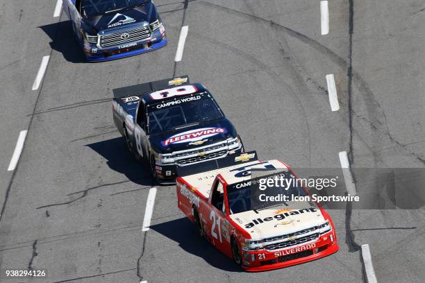 Johnny Sauter, GMS Racing, Chevrolet Silverado Allegiant Airlines leads John Hunter Nemechek, NEMCO Motorsports, Chevrolet Silverado into Turn 1...