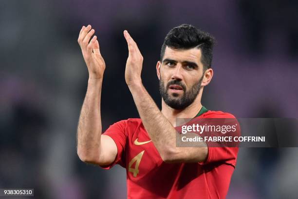 Portugal's defender Luis Neto applauds at the end of the international friendly football match between Portugal and Netherlands at Stade de Geneve...