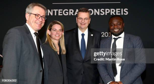 Reinhard Grindel , president of the German football federation pose with Nia Kuenzer and Gerald Asamoah during Integration Prize Awarding Ceremony at...