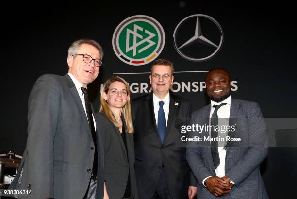 Reinhard Grindel , president of the German football federation pose with Nia Kuenzer and Gerald Asamoah during Integration Prize Awarding Ceremony at...