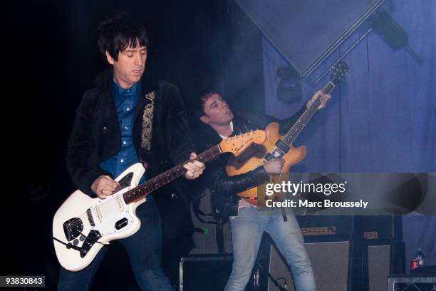 Johnny Marr and Ryan Jarman of The Cribs perform on stage at Brixton Academy on December 3, 2009 in London, England.