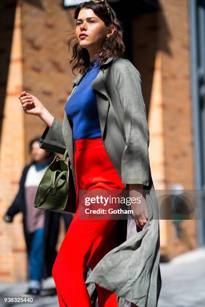 Georgia Fowler is seen wearing Khaite pants, an Une Heures top with an Elleme handbag, Bec & Bridge sunglasses and Altuzarra boots in SoHo on March...