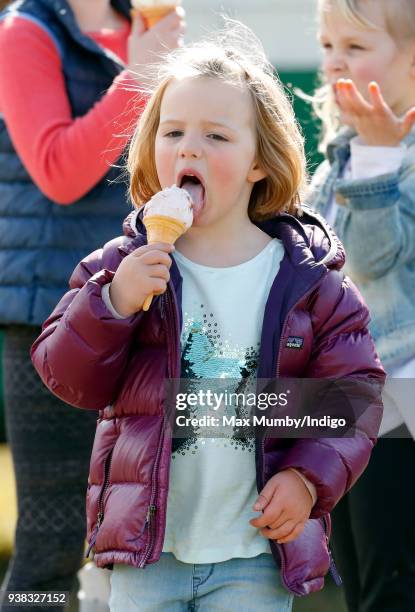 Mia Tindall eats an ice cream as she attends the Gatcombe Horse Trials at Gatcombe Park on March 25, 2018 in Stroud, England.