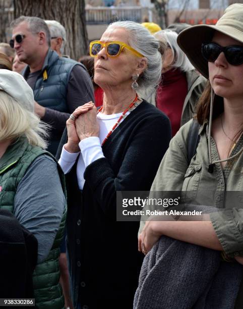 Actress Ali Macgraw reacts to an emotional address by a high school student at a 'March For Our Lives' rally in Santa Fe, New Mexico. The rally and...