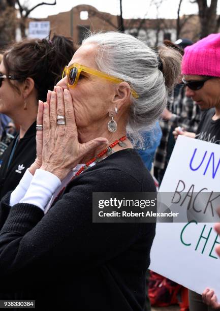 Actress Ali Macgraw reacts to an emotional address by a high school student at a 'March For Our Lives' rally in Santa Fe, New Mexico. The rally and...