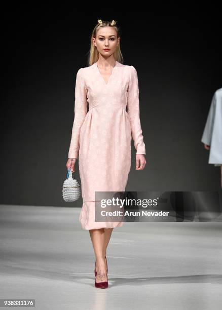 Model walks the runway wearing PYT at 2018 Vancouver Fashion Week - Day 4 on March 22, 2018 in Vancouver, Canada.