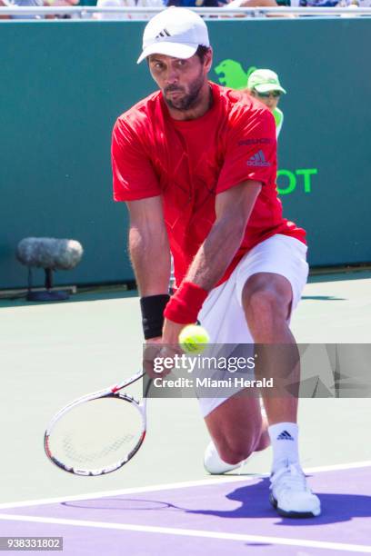 Fernando Verdasco returns the ball to Thanasi Kokkinakis during the Miami Open tennis tournament in Key Biscayne, Fla., Monday, March 26, 2018.