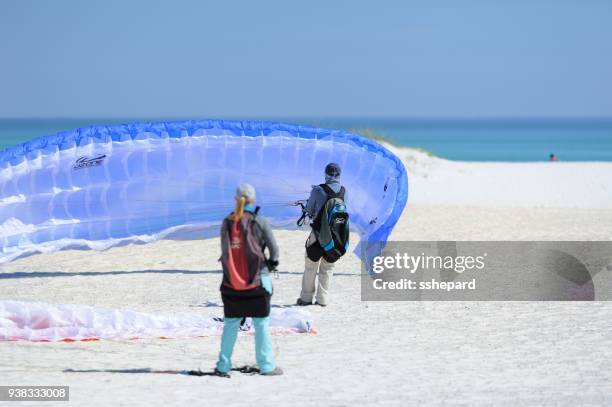 paragliders at pensacola beach - motor paraglider stock pictures, royalty-free photos & images