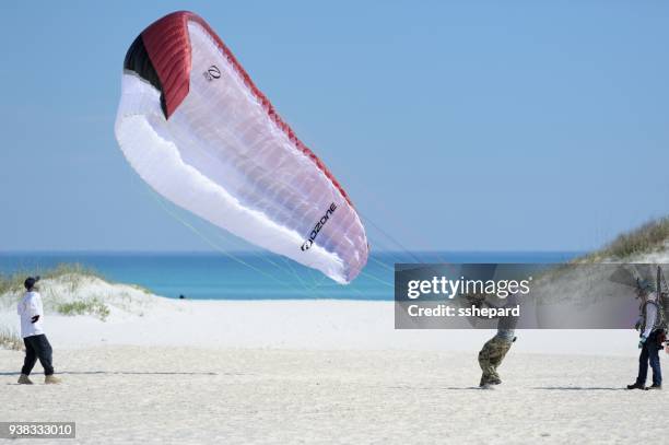 paragliding practice or training at pensacola beach in florida - motor paraglider stock pictures, royalty-free photos & images