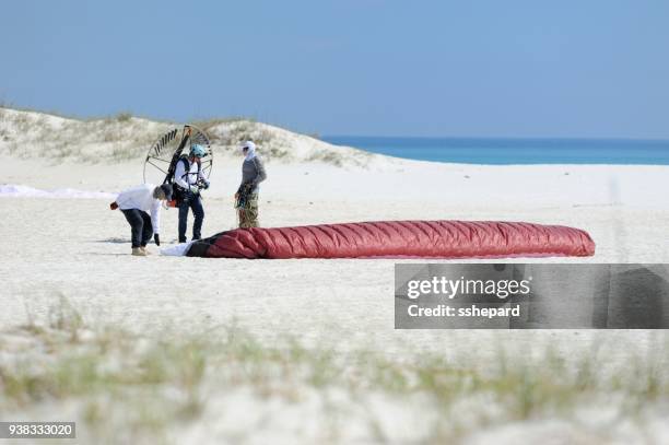powered paragliding at pensacola beach - motor paraglider stock pictures, royalty-free photos & images