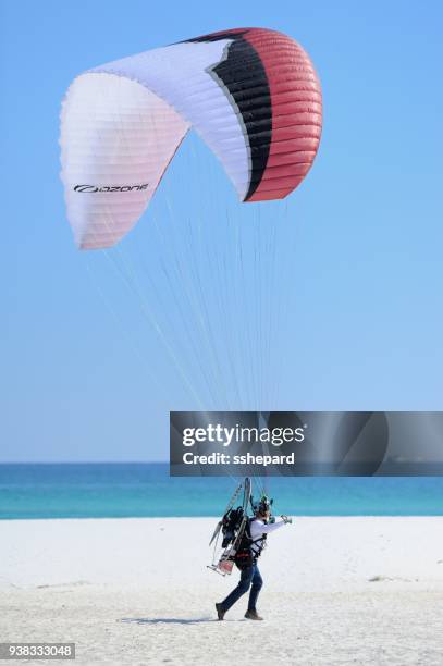 powered paragliding taking off at pensacola beach in florida - motor paraglider stock pictures, royalty-free photos & images