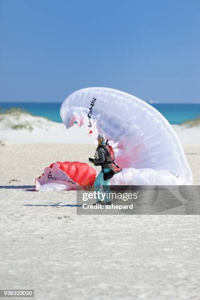 preparing to paraglide at pensacola beach in florida - motor paraglider stock pictures, royalty-free photos & images