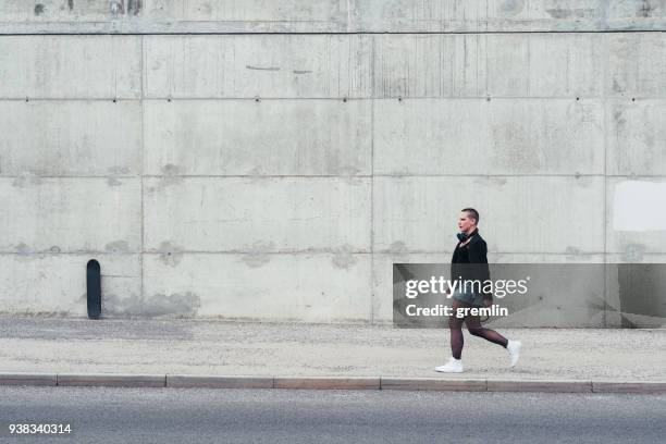 street style woman walking in the city - concrete sidewalk stock pictures, royalty-free photos & images