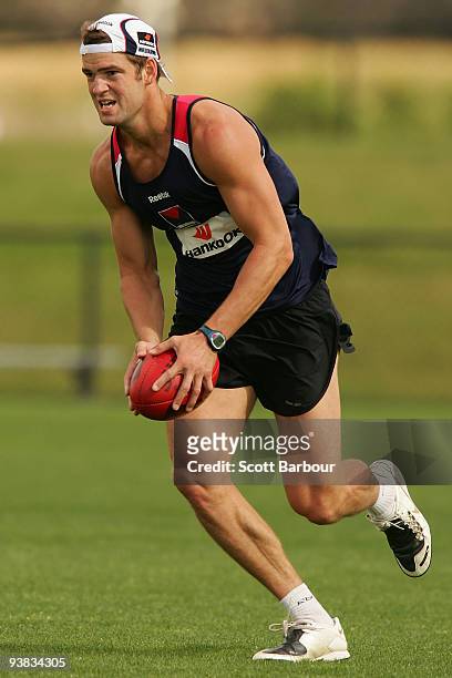 Jared Rivers of the Demons runs with the ball during a Melbourne Demons AFL training session at Casey Fields on December 4, 2009 in Melbourne,...