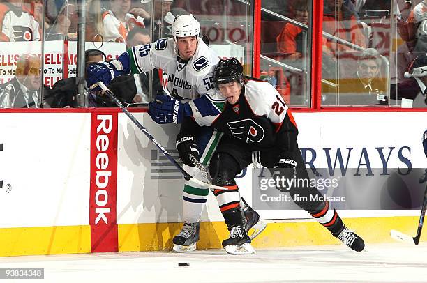 James van Riemsdyk of the Philadelphia Flyers defends against Shane O'Brien of the Vancouver Canucks on December 3, 2009 at Wachovia Center in...