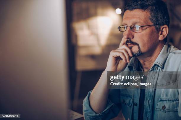 mid adult man in office - man business hipster dark smile stock pictures, royalty-free photos & images